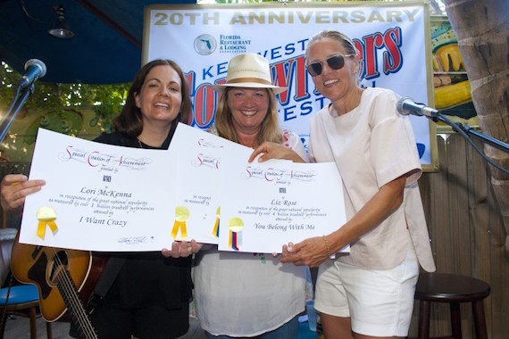 Pictured: Lori McKenna and Liz Rose receive certificates of achievement for 1 million plus broadcast performances from BMIs Leslie Roberts at Blue Heaven during the Key West Songwriters Festival on May 7, 2015, in Key West, FL. Photo: Erika Goldring. 