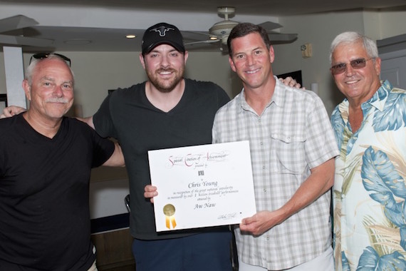 Pictured: KWSWFs Charlie Bauer, Chris Young, BMIs Mark Mason and Mayor Craig Cates gather for a photo after presenting Young with a certificate of achievement during Key West Songwriters Festival on May 9, 2015, in Key West, Fla. Photo: Erika Goldring.