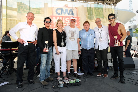 At CMA World GlobaLive! trophies were present to event host Morgan Evans, who received the CMA Global Country Artist Award, and CMA Board member and CEO of Big Machine Label Group Scott Borchetta, who received the Jo Walker-Meador International Award. (L-R): Frank Bumstead, Chairman Flood Bumstead McCready & McCarthy, Inc. and CMA Board Chairman; Scott Borchetta; Sarah Trahern, CMA Chief Executive Officer; Rob Potts, CEO and Manager Director of Rob Potts Entertainment Edge, and CMA International Committee Vice Chairman; Jeff Walker, CEO/Founder of AristoMedia, CMA World GlobaLive! Executive Producer, and CMA Board member; David Ross, President of BossRoss Media and CMA Board member; and Morgan Evans. Photo: John Russell / CMA