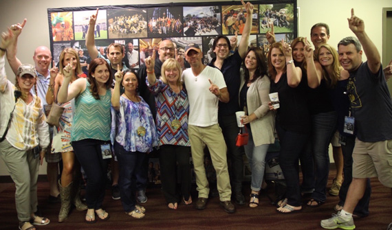 Kenny Chesney celebrates his 27th #1 for Wild Child with radio programmers in  Atlanta during The Big Revival tour date at the Georgia Dome. (L-R): Back Row: Sony Nashville Director/Promotion R.G. Jones, guest Jennifer Willis, iHeart Media Atlanta Senior VP/Programming Brian Michel, WKCN Columbus, GA PD Dave Arwood, Cumulus Media Corporate Program Director Greg Frey, and Point-To-Point Marketing VP/Digital Tim Satterfield. Front Row: Morris-Higham Management VP/Radio & Marketing Buffy Cooper, Columbia Nashville Manager/Radio Promotion Samantha Borenstein, spouse Tanya Arwood, WDEN Macon Program Director Laura Starling, Chesney, spouse Caryn Frey, guest Amanda Ward, WUBL Atlanta MD/Midday host Angie Ward, Columbia Nashville Event and Promotions Specialist Mary Allison, and Columbia Nashville National Director/Field Promotion David Friedman.