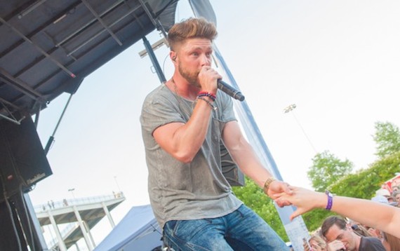 BMI singer-songwriter Chris Lane rocks the crowd from the BMI Tailgate stage during CMA Fest. Fans can check him out on tour this summer while he works on an upcoming album.