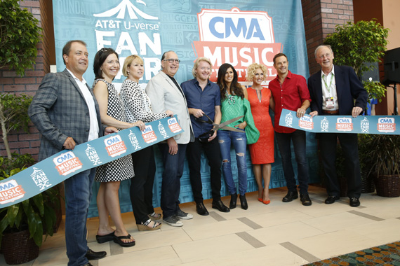 Thursday's Artist of the Day Little Big Town cut the ribbon to AT&T U-verse Fan Fair X at the Music City Center, kicking off the 2015 CMA Music Festival. (L-R): Brian Collins, Vice President of Wireline Consumer Marketing, AT&T Home Solutions; Sally Williams, Vice President, Business and Partnership Development of Ryman Auditorium and CMA Board President Elect; Sarah Trahern, CMA Chief Executive Officer; John Esposito, CEO Warner Music Nashville and CMA Board President; Little Big Town's Phillip Sweet, Karen Fairchild, Kimberly Schlapman, and Jimi Westbrook; and Frank Bumstead, Chairman Flood, Bumstead, McCready & McCarthy and CMA Board Chairman. Photo: John Russell/CMA