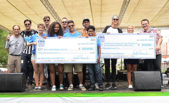 Pictured: (front, L-R:) W.O. Smith Camp BackBeat students Gloria Lomax, Kira Wolfe, Christian Balderas, and Javon'Tae Blackmun. (back, l-r) Jonah Rabinowitz, W.O. Smith School Executive Director; John and Jacob's Jacob Bryant, John Davidson, Austin Smith, Jake Thrasher, and Trevor Davis; Tiffany Kerns, CMA Community Outreach Manager; and John Tumminello, Musicians Corner Executive Director Photo Credit: Caitlin Harris / CMA