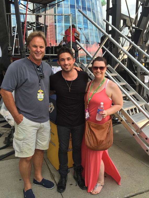 Atlantic Records artist Michael Ray brought his Top 15 and climbing debut single, Kiss You In The Morning, to sunbathed crowd at the CMA Music Festival. Following his performance yesterday on the Bud Light Stage at Bridgestone Arena, Ray visited with fans, friends and family. Photo from left to right  Scott Hendricks, Rays producer and EVP A&R Warner Music Nashville; Ray and Rebekah Gordon, Director A&R, WMN