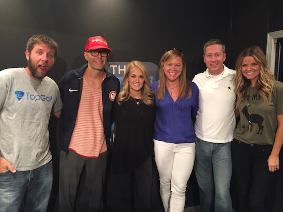 Pictured (L-R): Bobby Bones Show co-host Lunchbox; host Bobby Bones; Carrie; Lesly Simon, VP, Promotion, Arista Nashville; Justin Cole, Director of Country Programming, Premiere Networks and co-host Amy. 