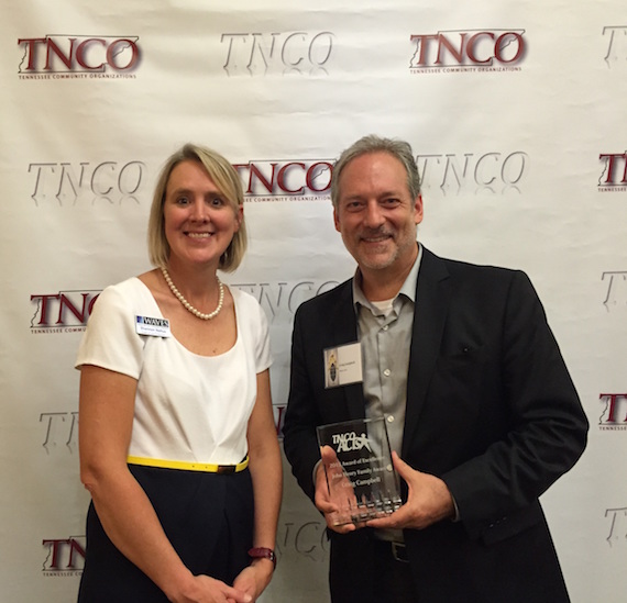 Phone Caption: (l. to r.) Shannon Nehus, Executive Director of Waves, with Craig Campbell, recipient of the 2015 John Henry Family Award. 