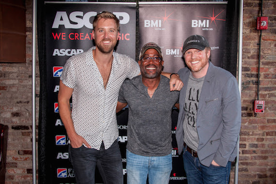 (Pictured, L-R): Charles Kelley, Darius Rucker and Nathan Chapman celebrate Rucker's No. 1 hit, "Homegrown Honey." Photo: Ed Rode