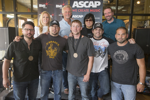 Celebrating Jason Aldeans No. 1 hit Just Gettin Started. (L-R): (back row): BMIs Leslie Roberts, Combustion Musics Chris Farren, ASCAPs John Titta and Sony/ATVs Josh VanValkenburg. (Front row): songwriter Chris DeStefano, BMI affiliate Jason Aldean, songwriter Ashley Gorely, BMI songwriter Rhett Akins and producer Michael Knox.