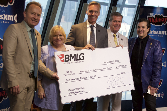 Pictured (L-R): Dr. Jay Steele (Chief Academic Officer), Dr. Nola Jones (Coordinator of Visual and Performing Arts), Chris Henson (Interim Director of Schools), Mayor Karl Dean and BMLGs Scott Borchetta with $100,000 donation to Music Makes Us. Photo: Lance Goodman