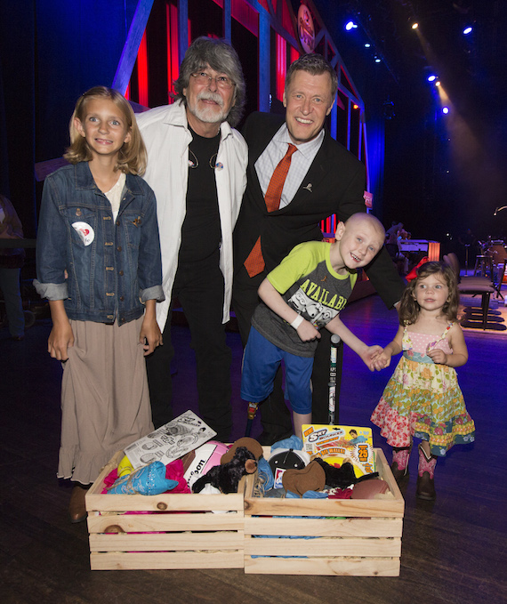 Country Cares for St. Jude Kids® co-founder Randy Owen and Opry announcer Bill Cody with St. Jude patients Ally, Mack and Harper (l to r) onstage at the Opry's celebration of Country Cares for St. Jude Kids.