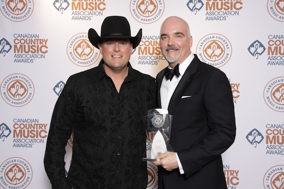 Gord Bamford (left) presented ole Chairman and CEO Robert Ott with the Leonard T. Rambeau International Award at the 2015 Canadian Country Music Awards.