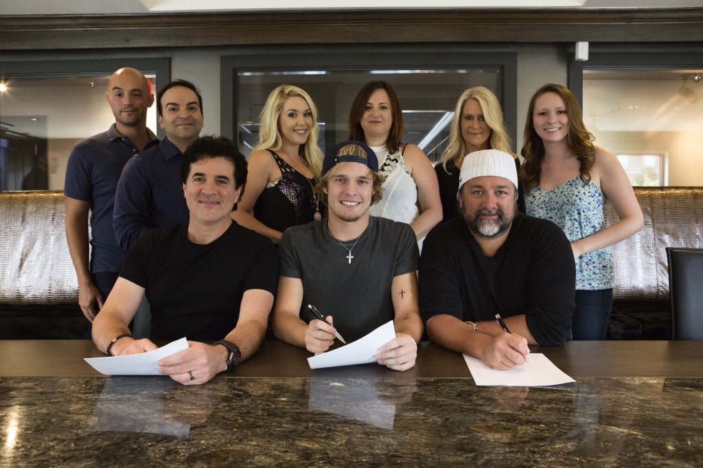 Pictured (L-R): Back Row  Big Machine Musics Alex Heddle, Mike Molinar, Tali Canterbury, Manager Mary Hilliard Harrington, Big Machine Label Groups Allison Jones and Big Machine Musics Brianna Steinitz Front Row  BMLGs Scott Borchetta, Tucker Beathard & Dot Records Chris Stacey Photo Credit: Seth Hellman for Dot Records.