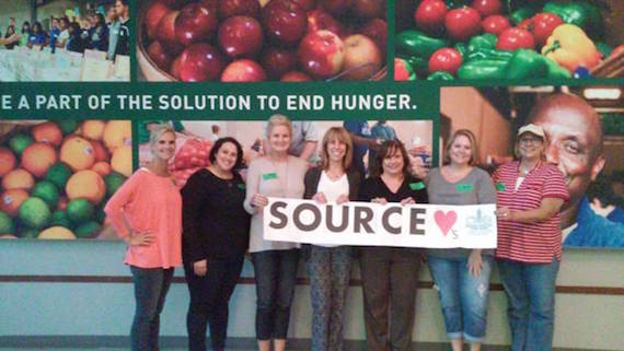 Pictured (L-R): Stacee McRea, and SOURCE Members Kari Barnhart, Karen Clark, Erika Wollam-Nichols, Denise Nichols, Leann Bennett, and Liz Morin. 