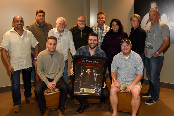 Sony Music Nashville presented Chris Young with a plaque celebrating the recent RIAA Gold certification of his current single, Im Comin Over. Back Row (L-R): Paul Barnabee (SVP, Marketing, Sony Music Nashville), Jim Catino (VP, A&R, Sony Music Nashville), Bill Simmons (Fitzgerald Hartley), Larry Fitzgerald (Fitzgerald Hartley), Steve Hodges (EVP, Promotions & Artist Development, Sony Music Nashville), Caryl Healey (VP, Sales, Sony Music Nashville), Angie Magill (VP, Legal & Business Affairs, Sony Music Nashville), Keith Gale (SVP/National Promotion, RCA) Front Row (L-R): Randy Goodman (Chairman & CEO, Sony Music Nashville), Young, Josh Easler (Director/National Promotion, RCA) Photo: Rick Diamond/Getty Images for Sony Music Nashville