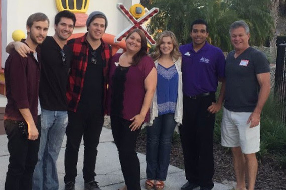 Pictured (L-R): band members Brent Layman, Matt Koerner, Phil Ortiz; Dee Dee Martin, Give Kids The World Village; Macy Martin; and volunteers. 