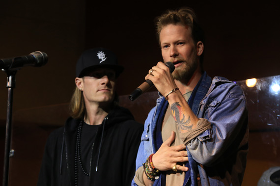 Tyler Hubbard (L) Brian Kelley (R) accept a slew of Challenge Coins and their second plaque for Group/Duo of the Year