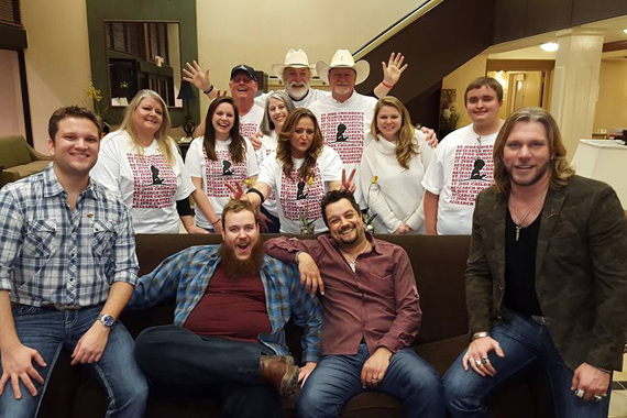 Craig Wayne Boyd (front right) with David Adam Byrnes (front left) and CJ Wilder (couch left) with crew from the Sudbury Broadcasting Group.