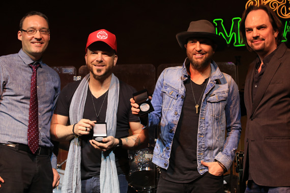 LOCASH accepts No. 1 Challenge Coins for writing and performing the final No. 1 on the MusicRow CountryBreakout Chart of 2015, I Love This Life (Dec. 17, 2015)