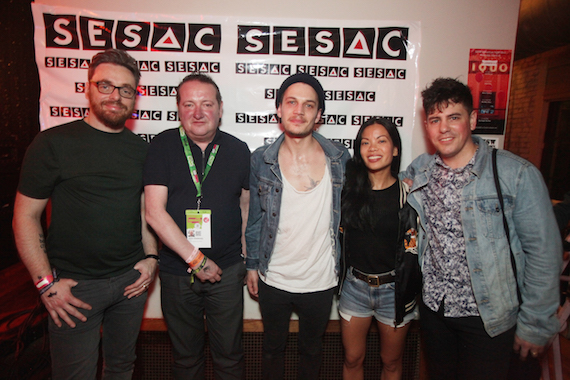 SESACs John Sweeney (second from left) and Jamie Dominguez (second from right) hang out with members of affiliated band, The Slow Show. 