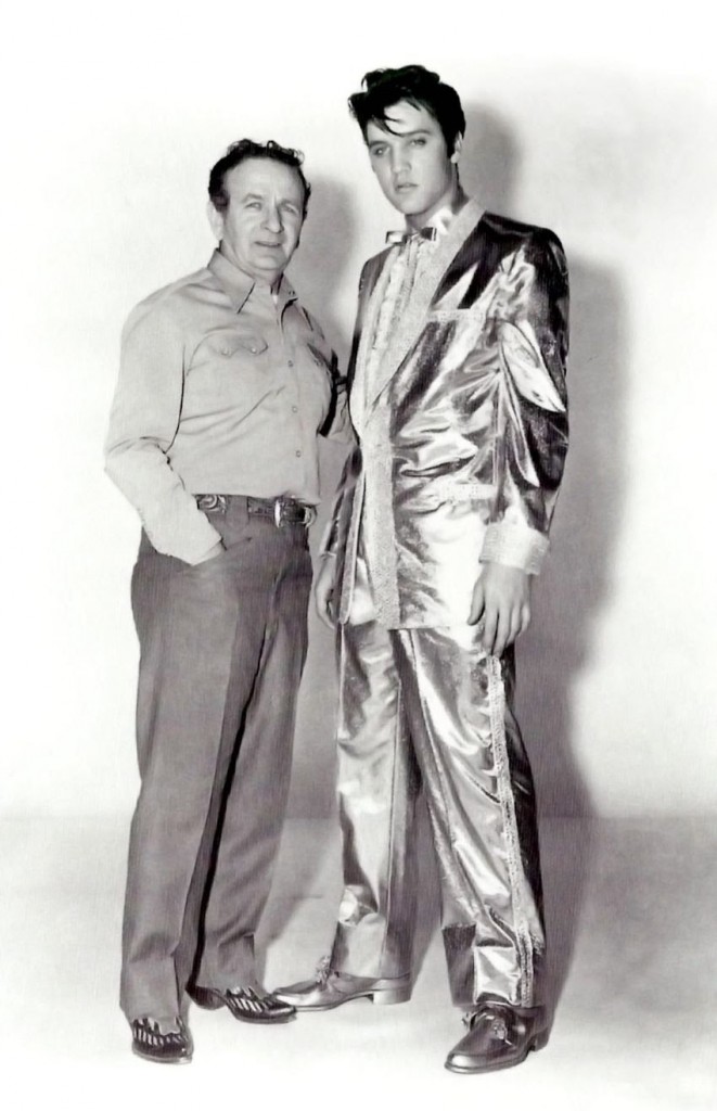 Many of Cohn's designs became signature looks for their owners. Among his most famous creations was Elvis Presley's $10,000 gold lam suit, worn by the singer on the cover of his 50,000,000 Elvis Fans Can't Be Wrong album. Pictured here: Nudie Cohn with Elvis 