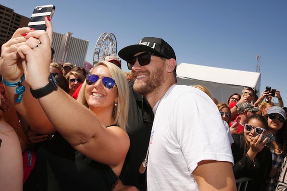 Chase Rice poses with a fan during the ACM & Cabela's Tic-Tac-Toe Archery Tournament. Photo: Getty Images/ACM