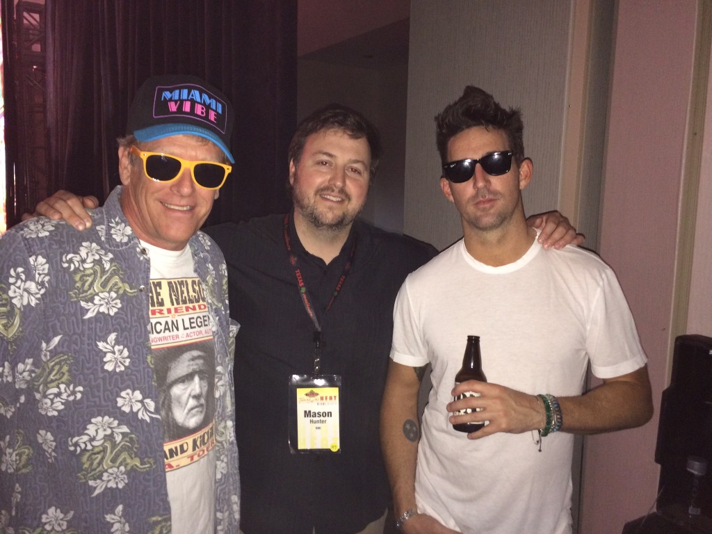 Pictured (L-R): Kent Taylor, President of Texas Roadhouse; Mason Hunter, BMI; Jake Owen. 