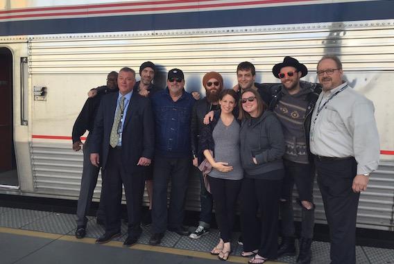 Pictured (Front row, L-R): Caitlyn Smith, Cornman's Shea Fowler. (Back row, L-R): Amtrak's James Ratliff, Amtrak's John Collins, Wilder Media's Justin Key, Songwriter Bob DiPiero, songwriter/producer Paul Moak, songwriter Rollie Gaalswyk, songwriter Ruston Kelly and Amtrak's Jerome Trahan. 