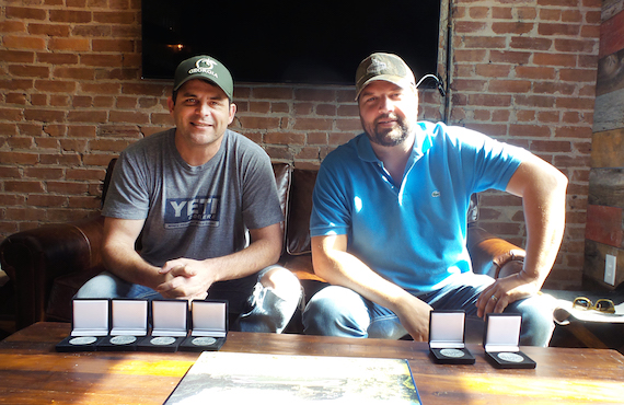 Peach Pickers members Rhett Akins and Dallas Davidson receive MusicRow Challenge Coins for penning