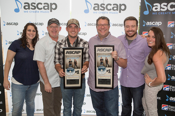 Cole Taylor poses with UMPG staff. Pictured (L-R): Missy Roberts; Ron Stuve; Cole Taylor; Kent Earls, Executive VP/GM, UMPG; Travis Gordon; Missy Roberts; and Amelia Varni