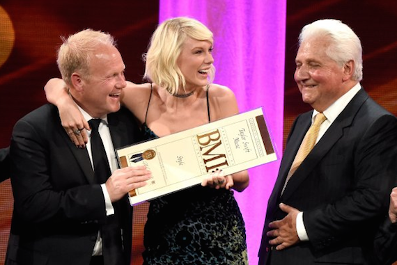 Pictured (L-R): President/CEO of Sony/ATV Music Publishing Nashville Troy Tomlinson, honoree Taylor Swift, and Sony/ATV CEO Martin Bandier pose with award onstage at The 64th Annual BMI Pop Awards. Photo: Frazer Harrison/Getty Images for BMI 