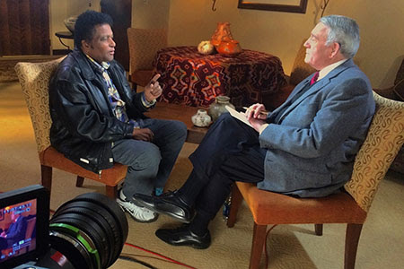 Charley Pride speaks with Dan Rather. Photo: