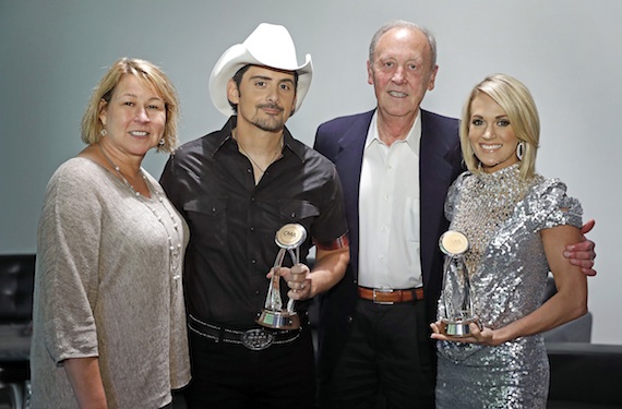 Pictured (L-R): Sarah Trahern, CMA Chief Executive Officer; Brad Paisley; Frank Bumstead, former CMA Board Chairman and Chairman of Flood, Bumstead, McCready & McCarthy, Inc.; Carrie Underwood. Photo: John Russell / CMA