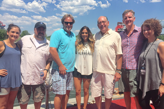 Pictured (L-R): Kathryn Woodard, Hill Entertainment; Chris Palmer, VP Promotion; Scott Hendricks, EVP A&R, WMN; Kramer; John Esposito, WMN Chairman & CEO; Greg Hill, Hill Entertainment; Lisa Ray, VP Brand Management, WMN. 