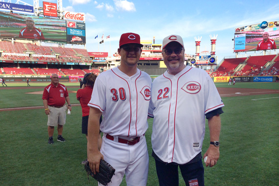 Mike Dungan, who serves as Chairman/CEO of Universal Music Group Nashville, throws the ceremonial first pitch to Reds outfielder Kyle Waldrop at the Cincinnati Reds game on Saturday, July 23, 2016.