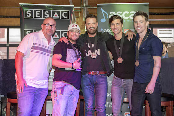 Pictured (L-R): Producer Derek George, SESAC songwriter Justin Wilson, Houser, and ASCAP songwriters John King and Matt Rogers. 