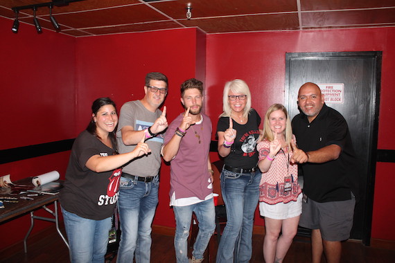 Pictured (L-R): WEBG Director of Promotions Emily Bermann, CBS Radio VP Programming/ WUSN PD Jeff Kapugi, Chris Lane, spouse Laurie Kapugi, WUSN APD Marci Braun, and Director Midwest Promotion Roger Fregoso. 