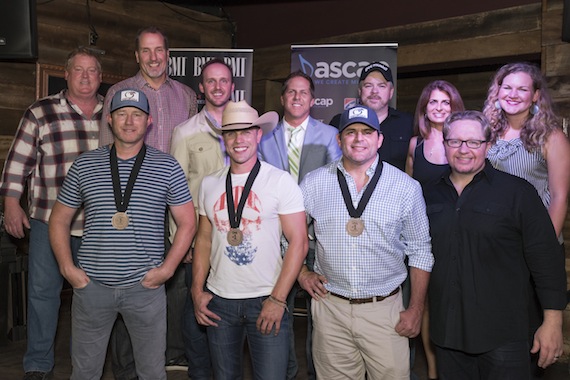 Pictured: (L-R): Back Row: ASCAPs Mike Sistad, Sony ATVs Tom Luteran, This Musics Rusty Gaston, Broken Bow Records Jon Loba, Warner/Chappells Ben Vaughn, Broken Bow Records Lee Adams and BMIs Nina Carter. Front Row: ASCAP songwriter Ben Hayslip, BMI artist Dustin Lynch, BMI songwriter Rhett Akins, producer Mickey Jack Cones. Photo: Steve Lowry.