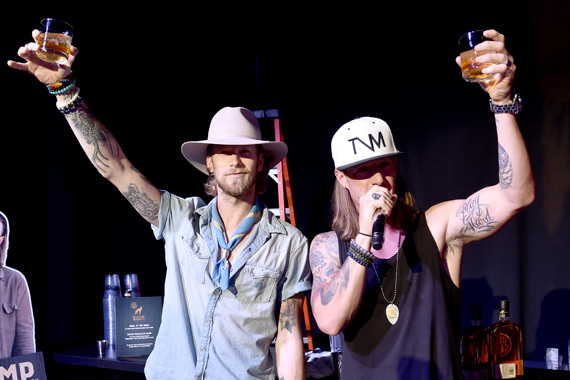 Florida Georgia Line's Brian Kelley (L) Tyler Hubbard (R) toast with their Old Camp whiskey and at OZ Arts Nashville, August 2. Photo: John Shearer/Getty Images for Pandora