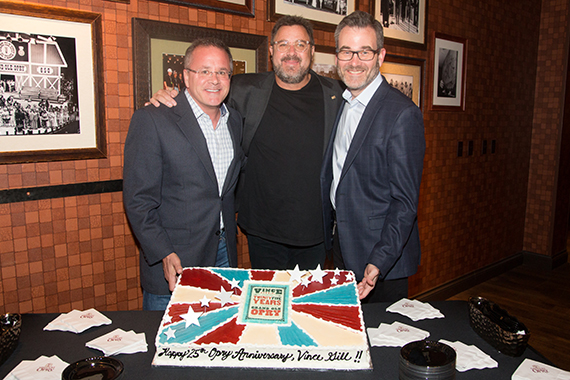 Vince Gill's 25th Anniversary cake celebration backstage with Grand Ole Opry's VP/GM Pete Fisher and President Opry Entertainment Group Steve Buchanan.