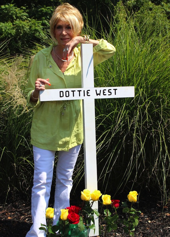 Jeannie Seely places a memorial cross on the 25th anniversary of the crash that claimed Dottie West's life.