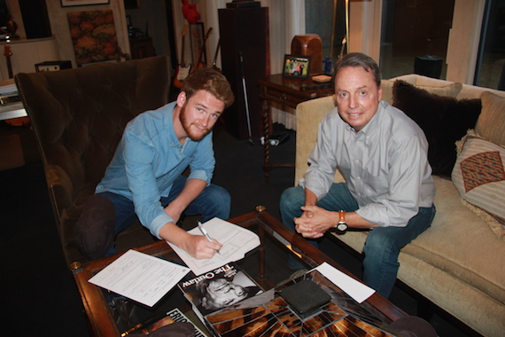 Pictured: Newly signed BMI songwriter Ben Haggard and BMIs Jody Williams pose for a photo in Jodys office. 