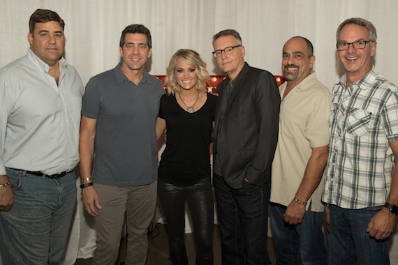 (Pictured L-R): Jim Catino, A&R VP; Ken Robold, EVP & COO; Carrie Underwood; Randy Goodman, Chairman & CEO; Paul Barnabee, Marketing Sr. VP; Steve Hodges, EVP Promotion & Artist Development. Photo credit: Jeff Johnson