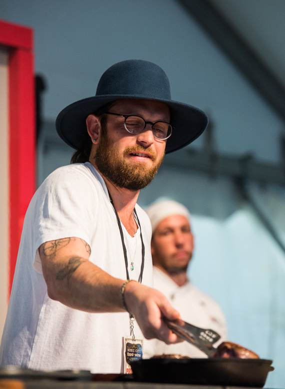 Kings of Leon's Nathan Followill lends a hand during a chef demo. Photo: Charles Reagan Hackleman