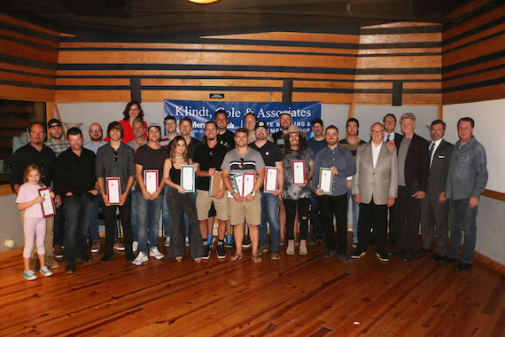 Songwriters with their No. 1 plaques.