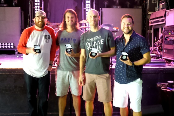 Eli Young Band accepts their MusicRow No. 1 Challenge Coin for "Dust."