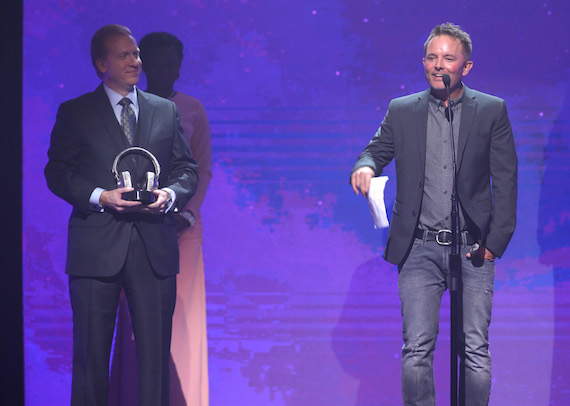 SoundExchange CEO and President Michael Huppe presents Chris Tomlin with an award for having his songs played more than one billion times on digital radio services during the 2016 Dove Awards at Allen Arena, Lipscomb University on Oct. 11, 2016 in Nashville, Tennessee. Photo: Terry Wyatt/Getty Images for Dove Awards