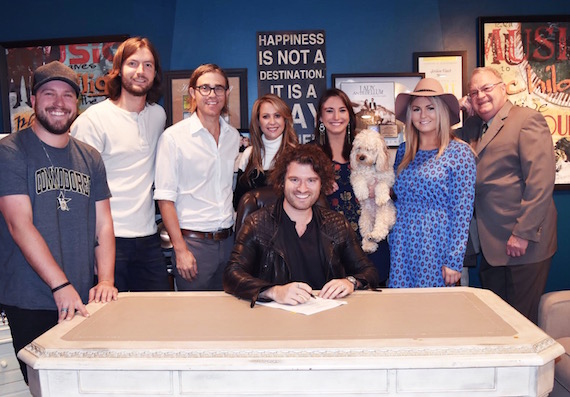 Front: Michael Whitworth. Back row, (L-R): Mitchell Tenpenny (Riser House), Jason VanAuken (Riser House), Jeff Colvin (representing Michael Whitworth), Jennifer Johnson (Riser House), Kristen Ashley (Riser House), Lilly-June (Dog/Riser House Mascot), Paige Pugh (Riser House), Jim Zumwalt (Representing Riser House) Attachments area 