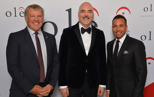 (L-R) Alex Lifeson of the rock band Rush; ole CEO and Chairman, Robert J. Ott; and Howie Dorough of the pop music band Backstreet Boys, celebrate 12 consecutive years of oles growth and success at the launch of the companys new headquarters in Bremner Tower, located in Torontos Southcore District