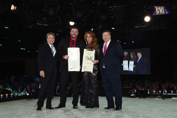 Pictured (L-R): RCA Records Nashville recording artist Chris Young and Sony/ATV's Hannah Williams on their BMI Top 50 Most Performed Song, "I'm Comin' Over," joined by BMI Executive Director, Writer/Publisher Relations, Bradley Collins. Photo: John Shearer