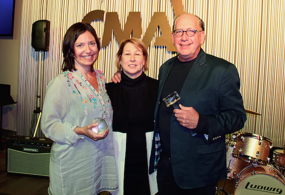 CMA Chief Executive Officer Sarah Trahern (center) presents incoming 2017 CMA Chairman Sally Williams and outgoing CMA Chairman John Esposito with the crystal globe and gavel during a Board dinner Monday at CMA's new Music Row headquarters. Photo: Christian Bottorff / CMA